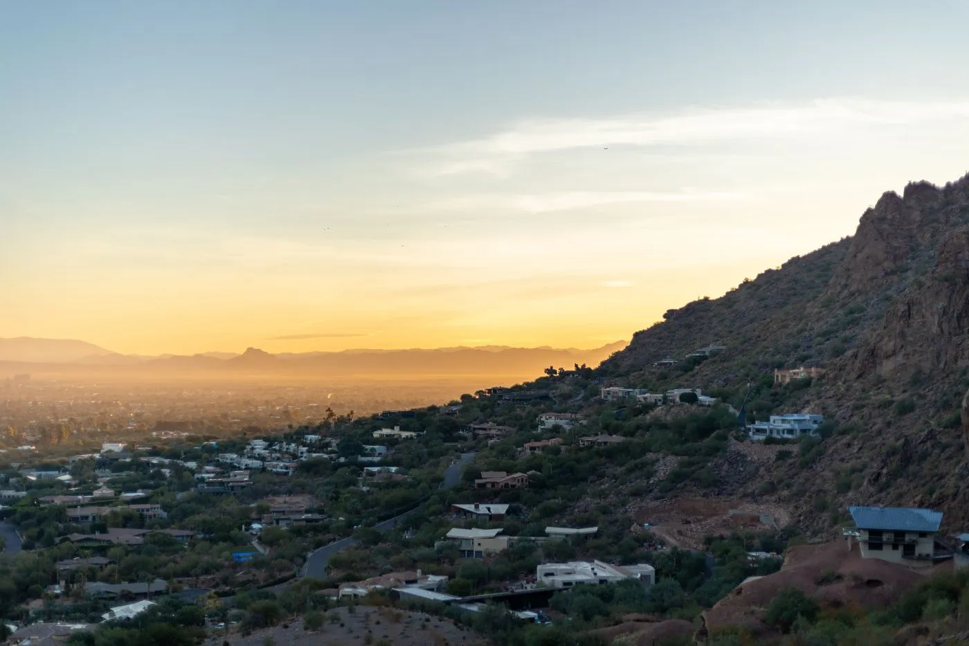 Phoenix cityscape and desert mountains at sunset