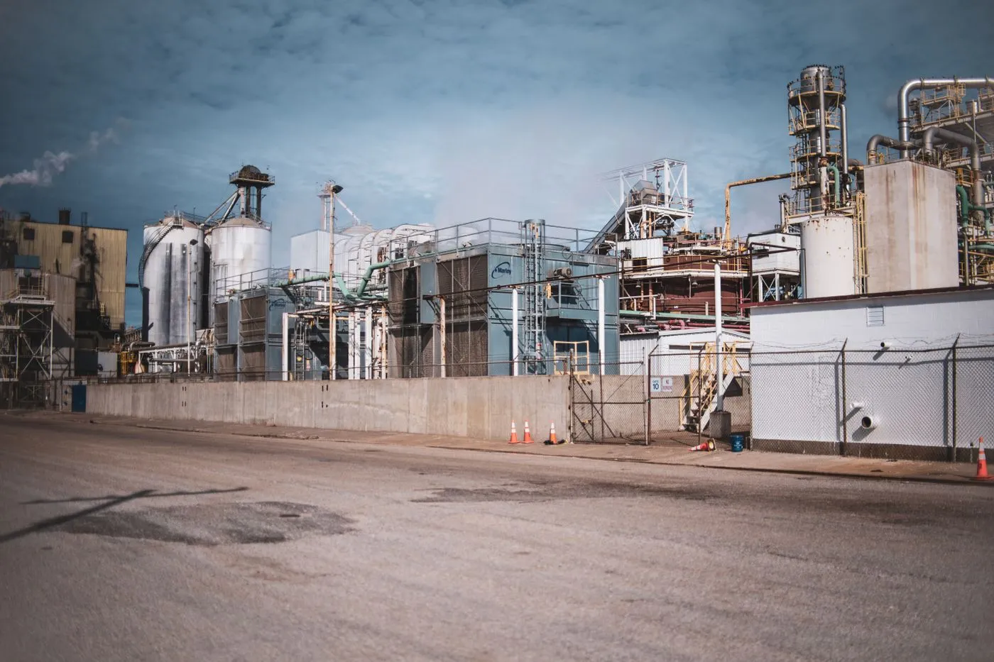 Industrial processing plant with steel structures and storage silos