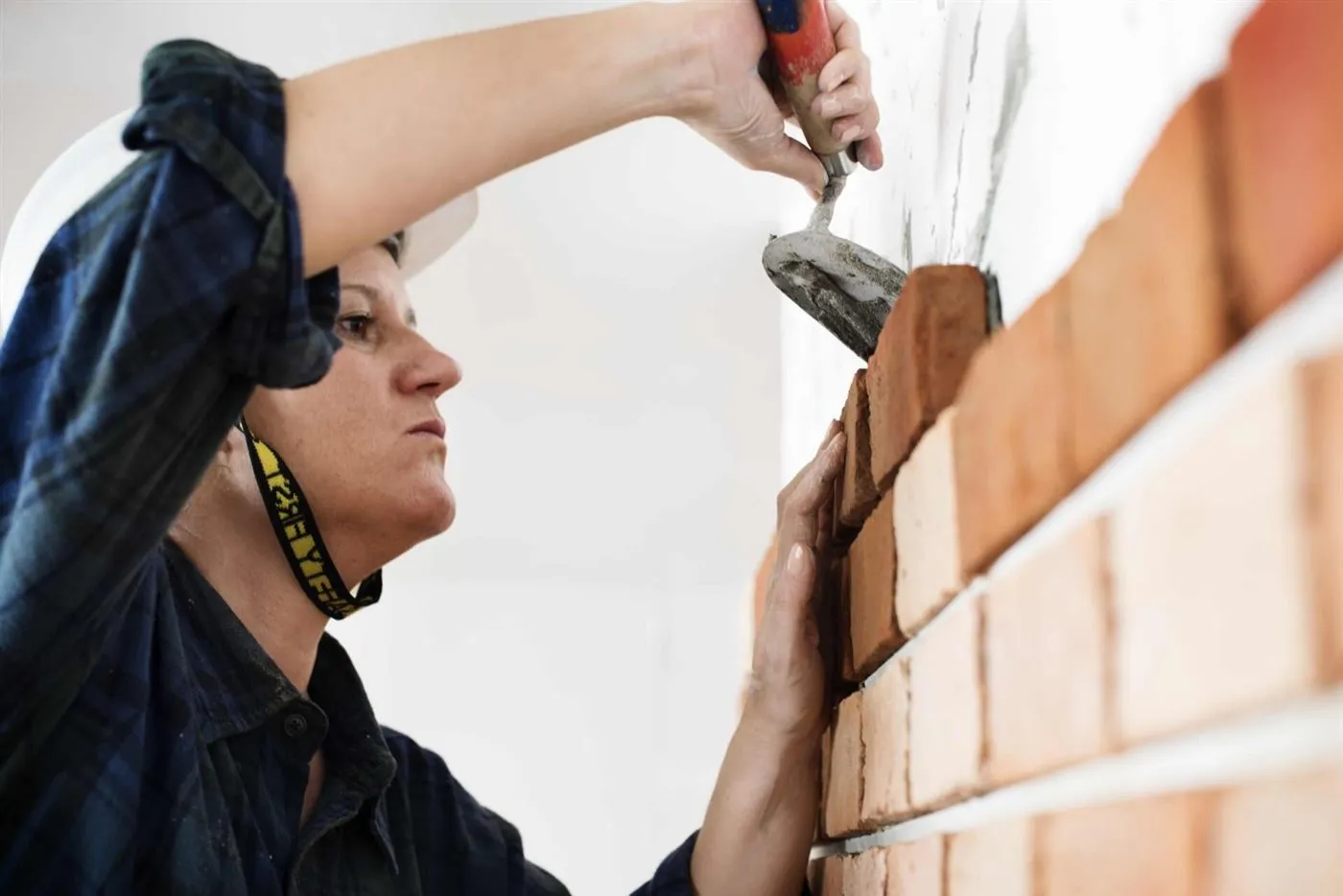Masons laying block on a commercial wall