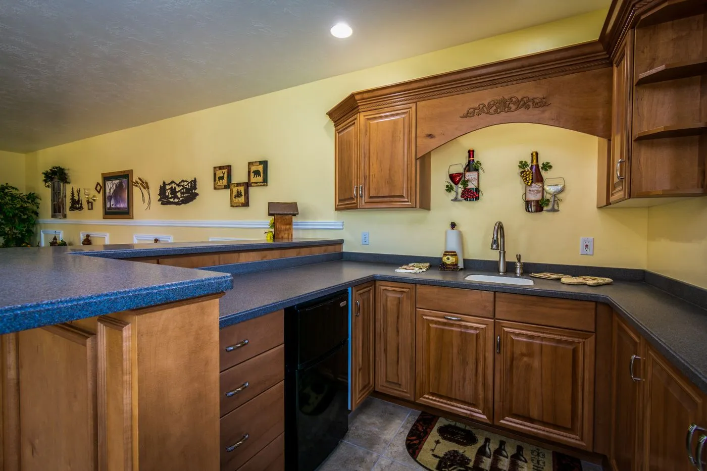 Kitchen with wood cabinetry and countertops